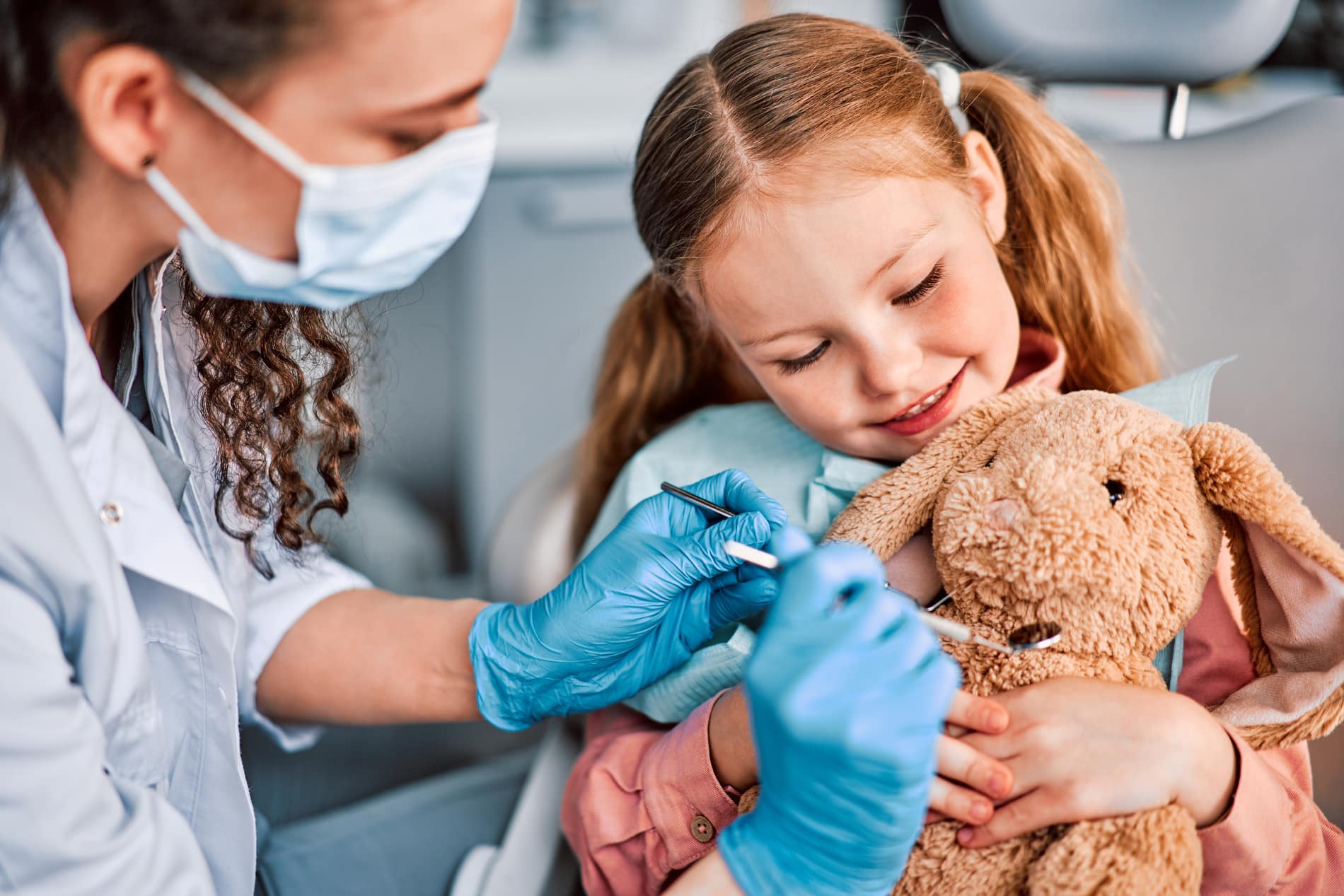 Child at her intial routine dental exam with Dr. Kritika